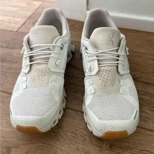 On Running Cream and White Athletic Shoes